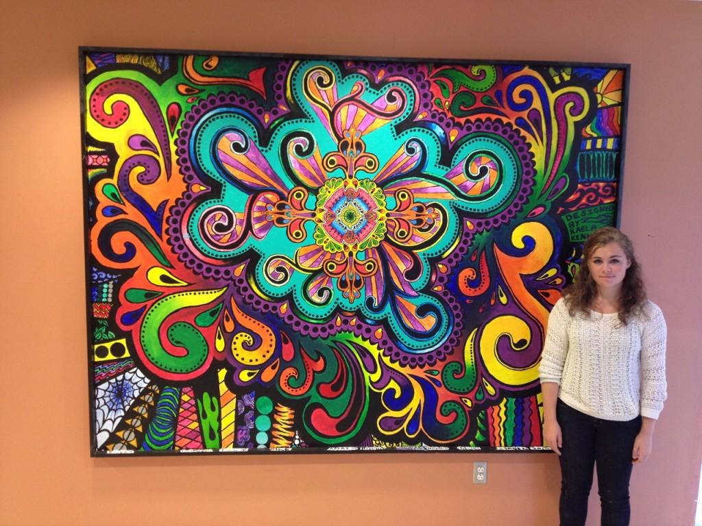 Senior Kaela Kennedy and her hallway mural