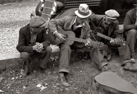 Men play bluegrass together on their way across the country