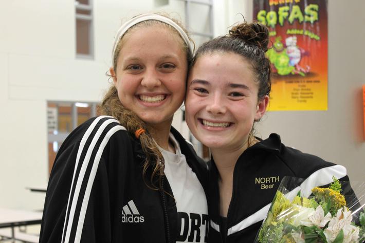 Captains Sarah Andrews and Jennifer Roth, junior, enjoy senior night, which was in October. 