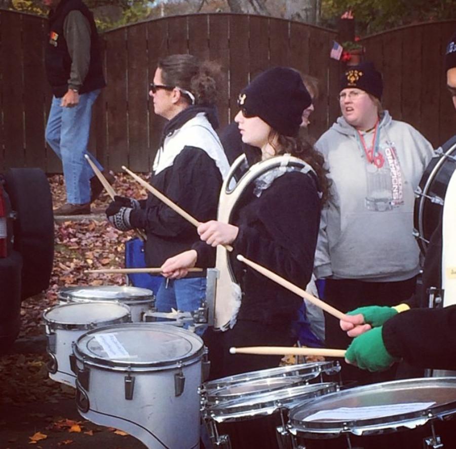 Katie Spitalnic plays the drums in the Veterans Day Parade.