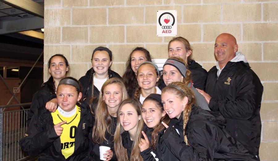 The+seniors+of+the+girls+soccer+team+with+their+coach+Mark+DArezzo+after+they+clinched+Division+I+South.