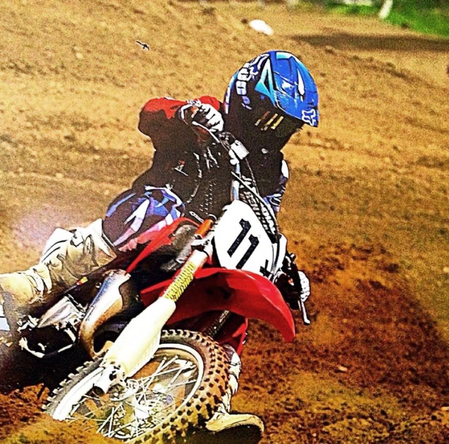 Sophomore Zach Joly competing in a dirt bike race. 
