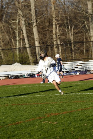 Senior Tristan Loughlin playing lacrosse