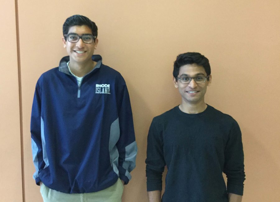 Senior and Junior Patel stand side by side.