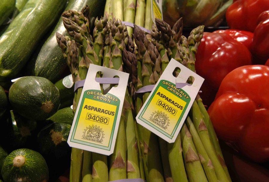 Organic asparagus sits between red peppers and zucchini at Dominick's in Chicago, Illinois. 