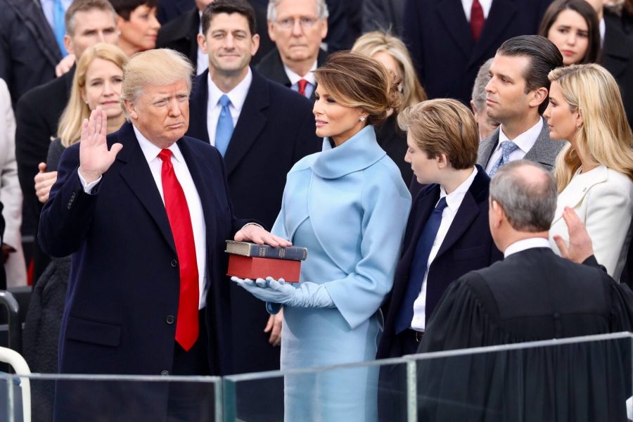 Donald Trump is sworn in as the 45th President of the United States on Jan. 20, 2017, while his wife, Melania, three of his children, and various government officials look on. 