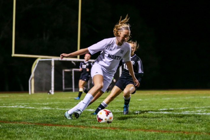 Senior Brooke Osmanski kicks the ball down the field during a game against Pilgrim High School in the fall of 2016. 