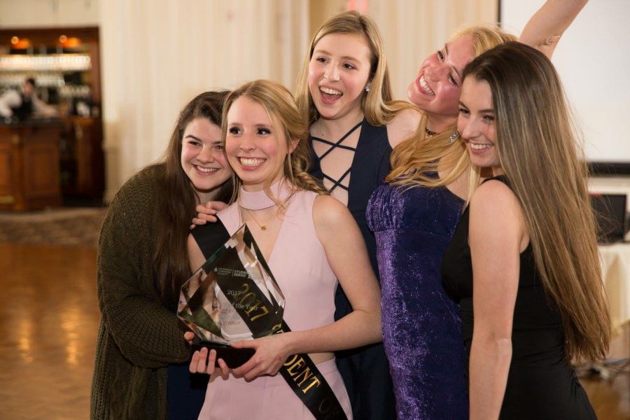 Junior Ali Hornung, center, is pictured with her younger sister, Brooke, and several of her friends at the LLS Awards Dinner on March 4. 