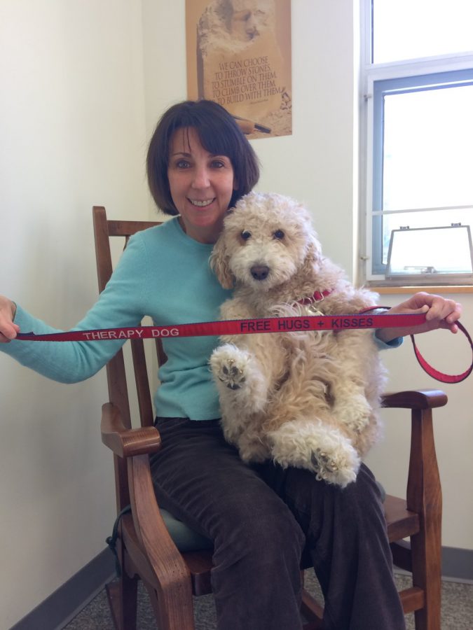 Whitney, NKHSs therapy dog, is pictured with Ms. Paula Calitri, the schools psychologist. 