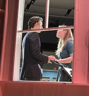 Senior Dan Macari (Tony Kirby) and junior Katie Bootle (Alice Sycamore) perform a scene during a rehearsal, taken by Costume Manager Lola Eustis from behind the set.