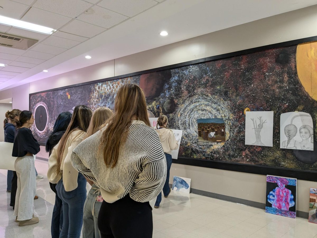 Students in Mrs. Mia Thompson's AP Art classes -- drawing, 2-D, and 3-D -- all work together to help improve their artwork on Mon., Oct. 7. Thompson said, "This is why I love critiques!" when positive feedback was shared between student artists. 