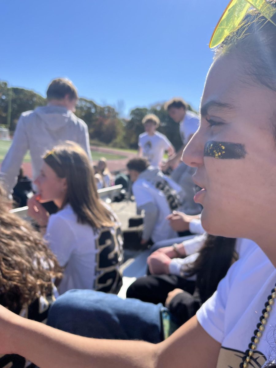 On Friday, Oct. 18, junior Mia D'Andrea attends the Pep Rally concluding the 2024 Spirit Week. Compared to previous years, many students were not as pleased with this Pep Rally. Mia was one of those students who noticed a drastic difference in how not only the Pep Rally was conducted, but Spirit Week as a whole. She explained how there were many last-minute changes that made it confusing for the students. "It's been a bit of a rough rally," Mia said. "I wish there was better coordination. It would've made Spirit Week a lot more fun."